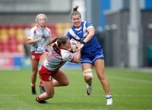 Picture by Ed Sykes/SWpix.com - 08/10/2023 - Rugby League - Betfred Women's Super League Group Two Promotion Final - Barrow Raiders v Leigh Leopards - LNER Community Stadium, York, England - Barrow Raiders' Claire Hutchinson and Leigh Leopards' Toryn Blackwood in action
