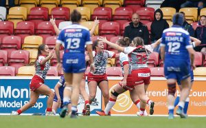 Picture by Ed Sykes/SWpix.com - 08/10/2023 - Rugby League - Betfred Women's Super League Group Two Promotion Final - Barrow Raiders v Leigh Leopards - LNER Community Stadium, York, England - Leigh Leopards' Hatice Dogus (L) celebrates scoring a try with team mates