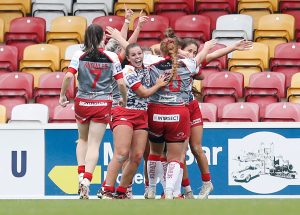 Picture by Ed Sykes/SWpix.com - 08/10/2023 - Rugby League - Betfred Women's Super League Group Two Promotion Final - Barrow Raiders v Leigh Leopards - LNER Community Stadium, York, England - Leigh Leopards' Hatice Dogus celebrates scoring a try with team mates